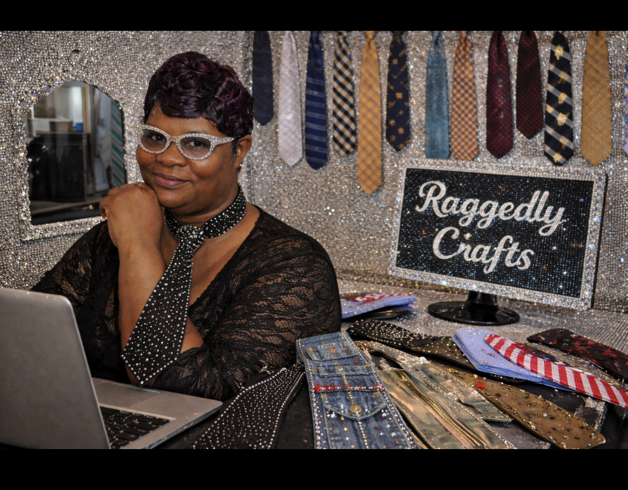 Raggedly Crafts founder with handmade rhinestone necktie necklaces